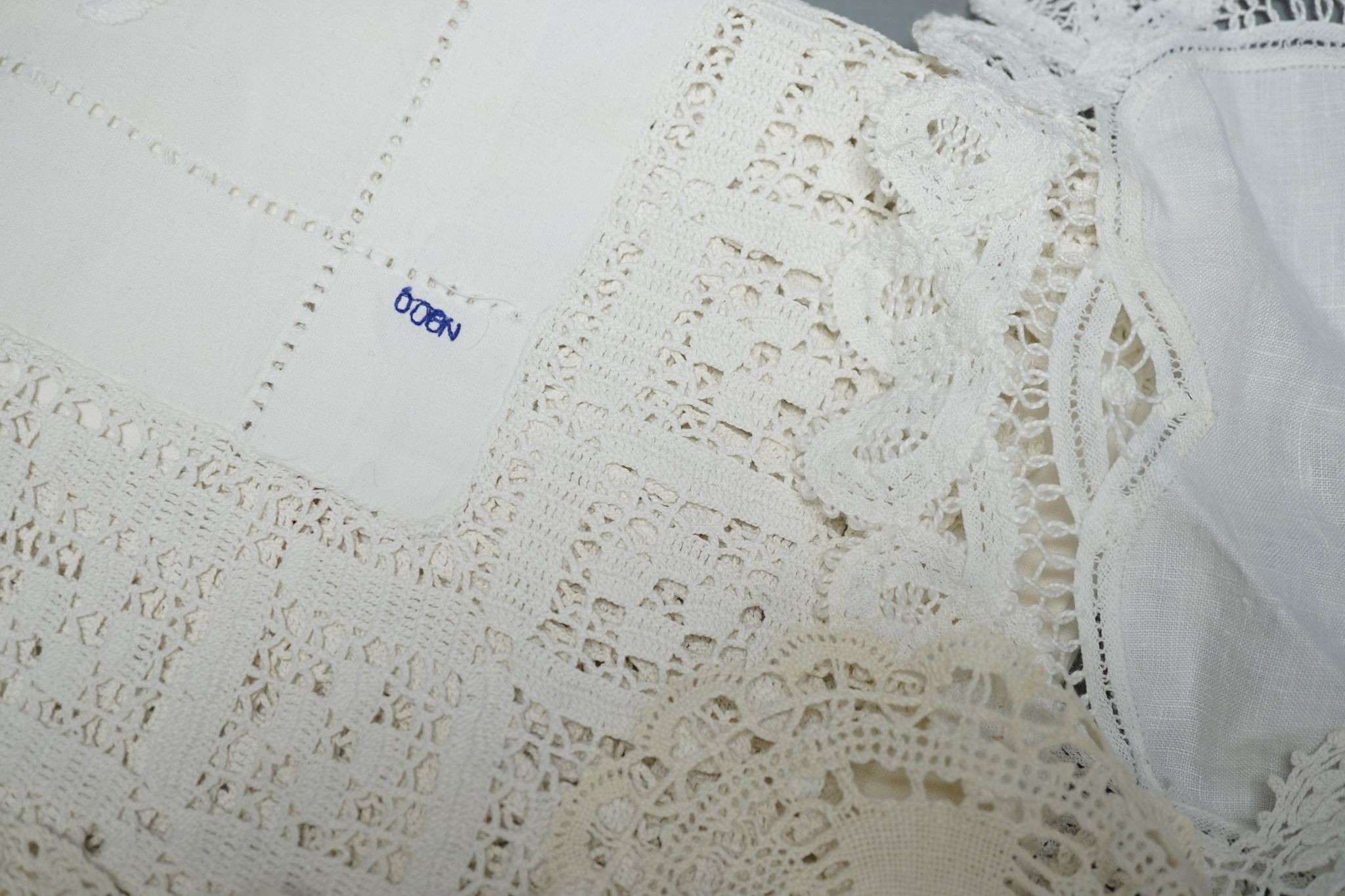 A quantity of mixed crochet, embroidered and cut work table linens.